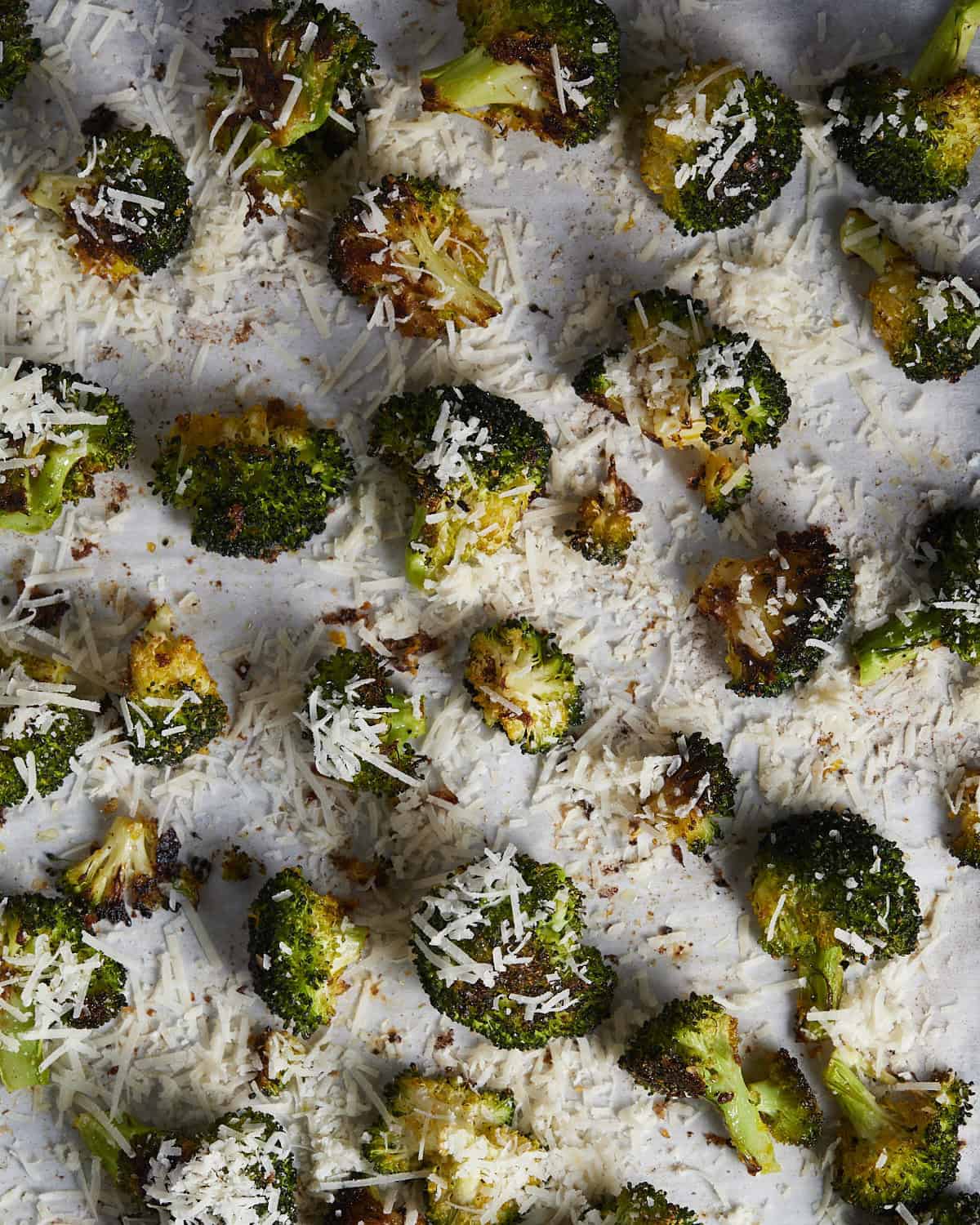 Broccoli topped with parmesan cheese. 