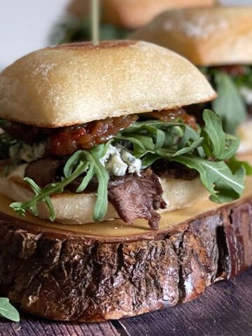 Steak Sliders with Blue Cheese on a wood board