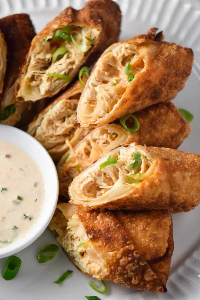 Buffalo-chicken-egg-rolls served with a dip on the side