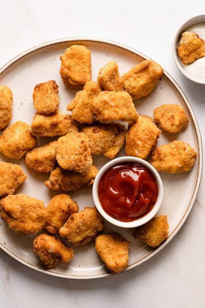 air-fryer-chicken-nuggets-on-plate served with ketchup