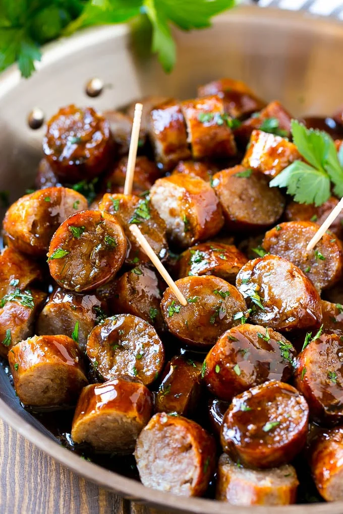 Bites of sausage brats with toothpicks.