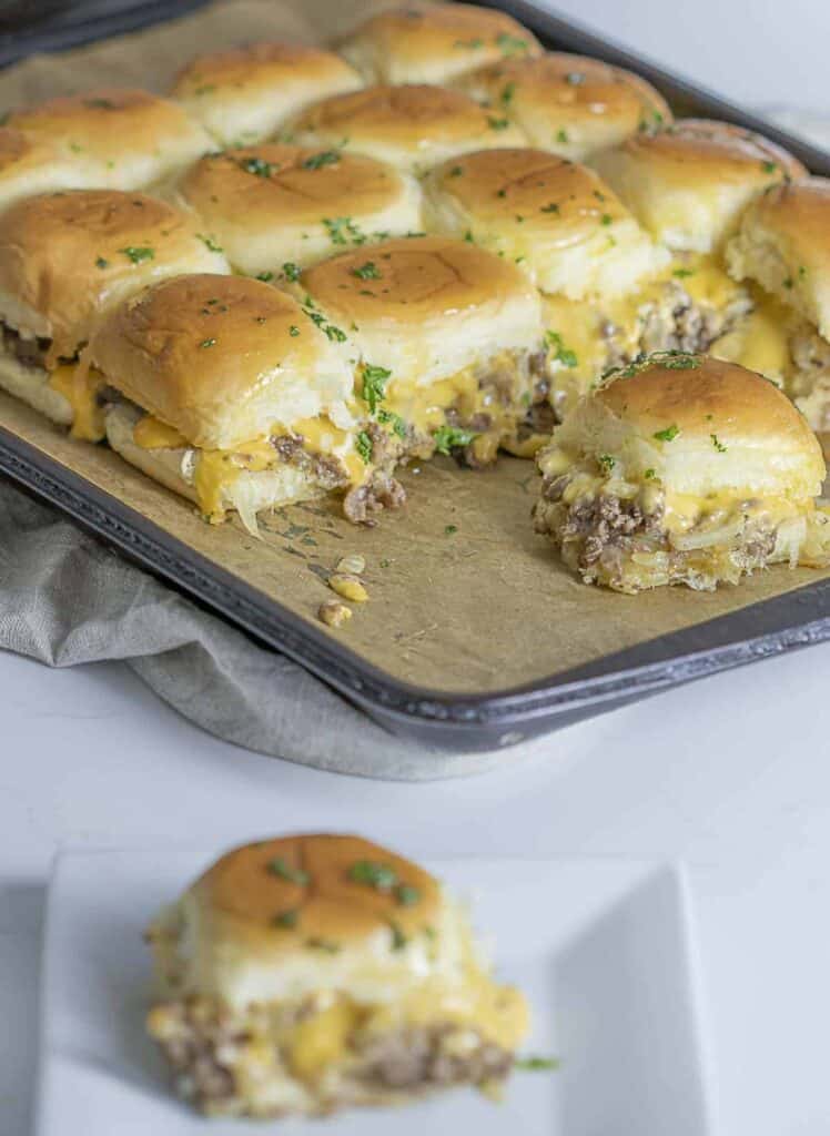 sliders on a sheet tray with parchment paper