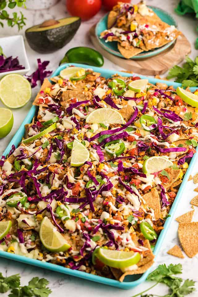 Sheet pan nachos with lime and cabbage.