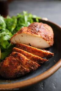 Up close side view of sliced chicken breast.