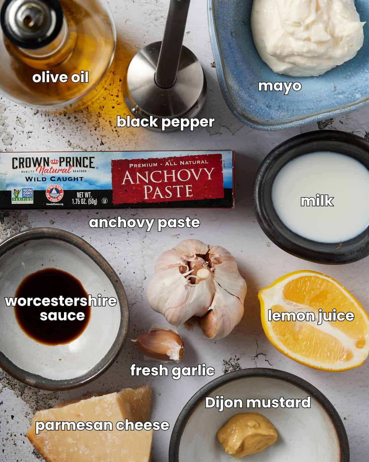 Ingredients needed to make the best Caesar dressing with mayo.