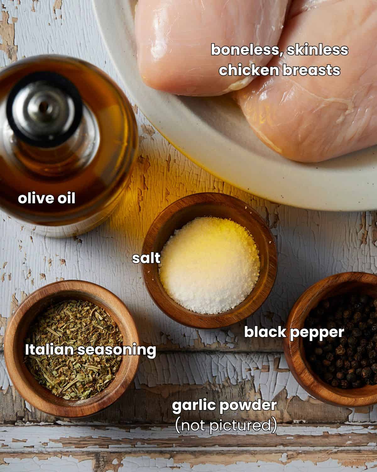 Ingredients needed to make air fryer chicken with rustic background. 