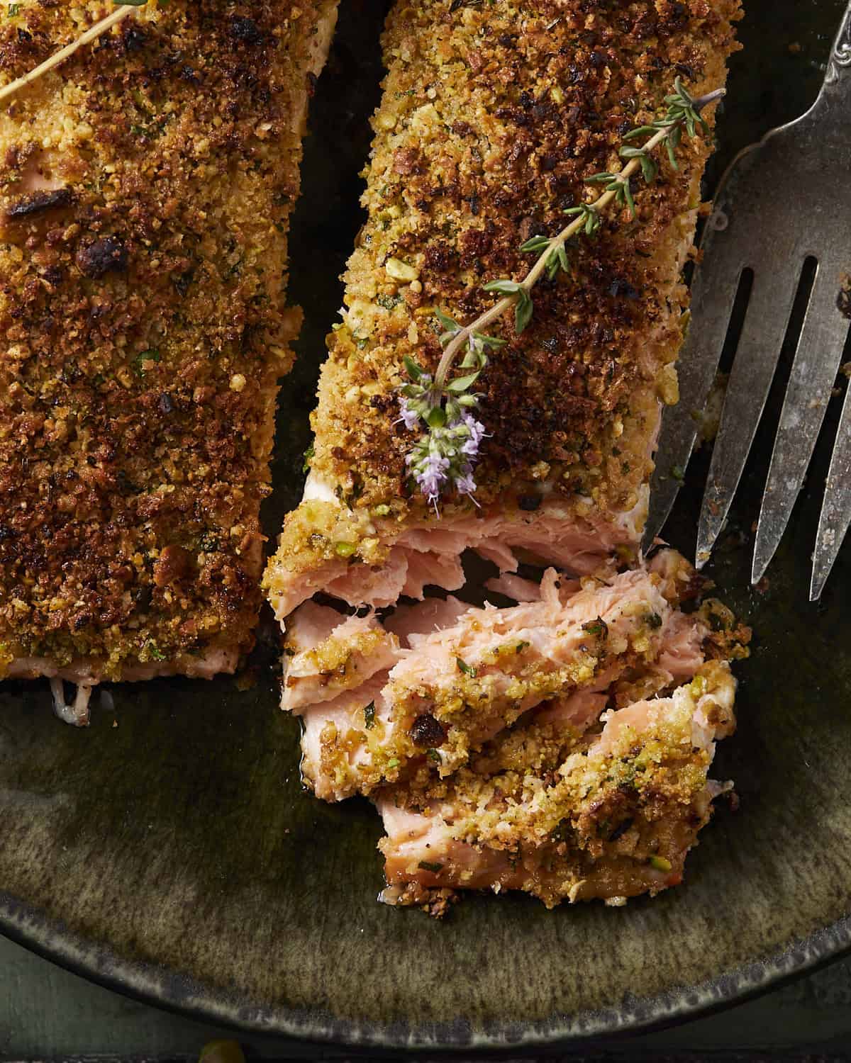 Up close of pistachio crusted salmon with flaky cooked layers.