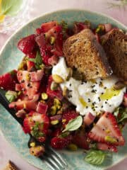 Strawberry rhubarb salad with burrata and pistachios.