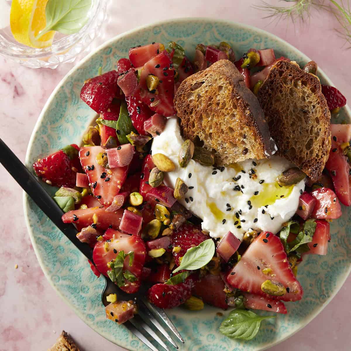 Strawberry rhubarb salad with burrata and pistachios. 