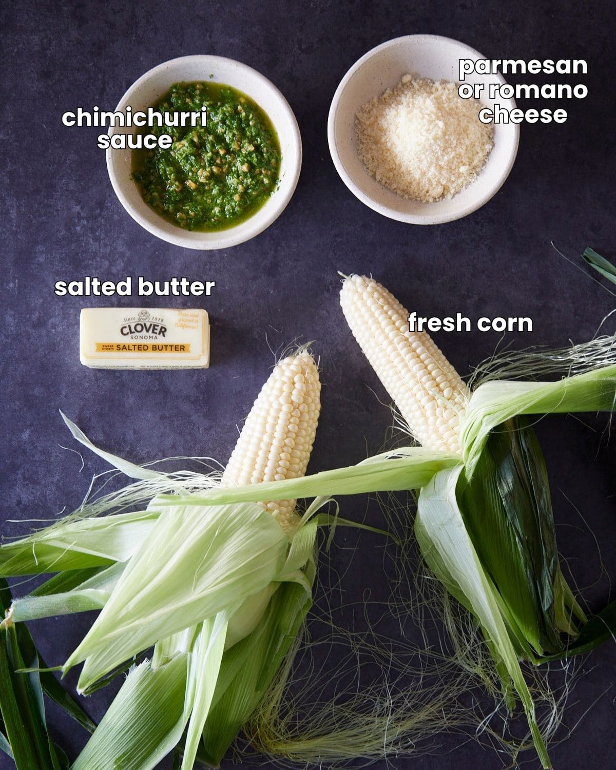 Ingredients needed to make chimichurri corn on a dark background.