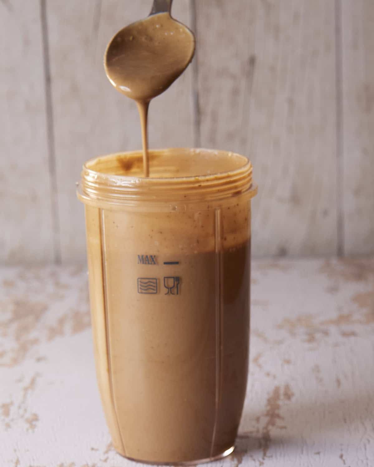 Blended balsamic vinaigrette all emulsified showing the thickness of the dressing.