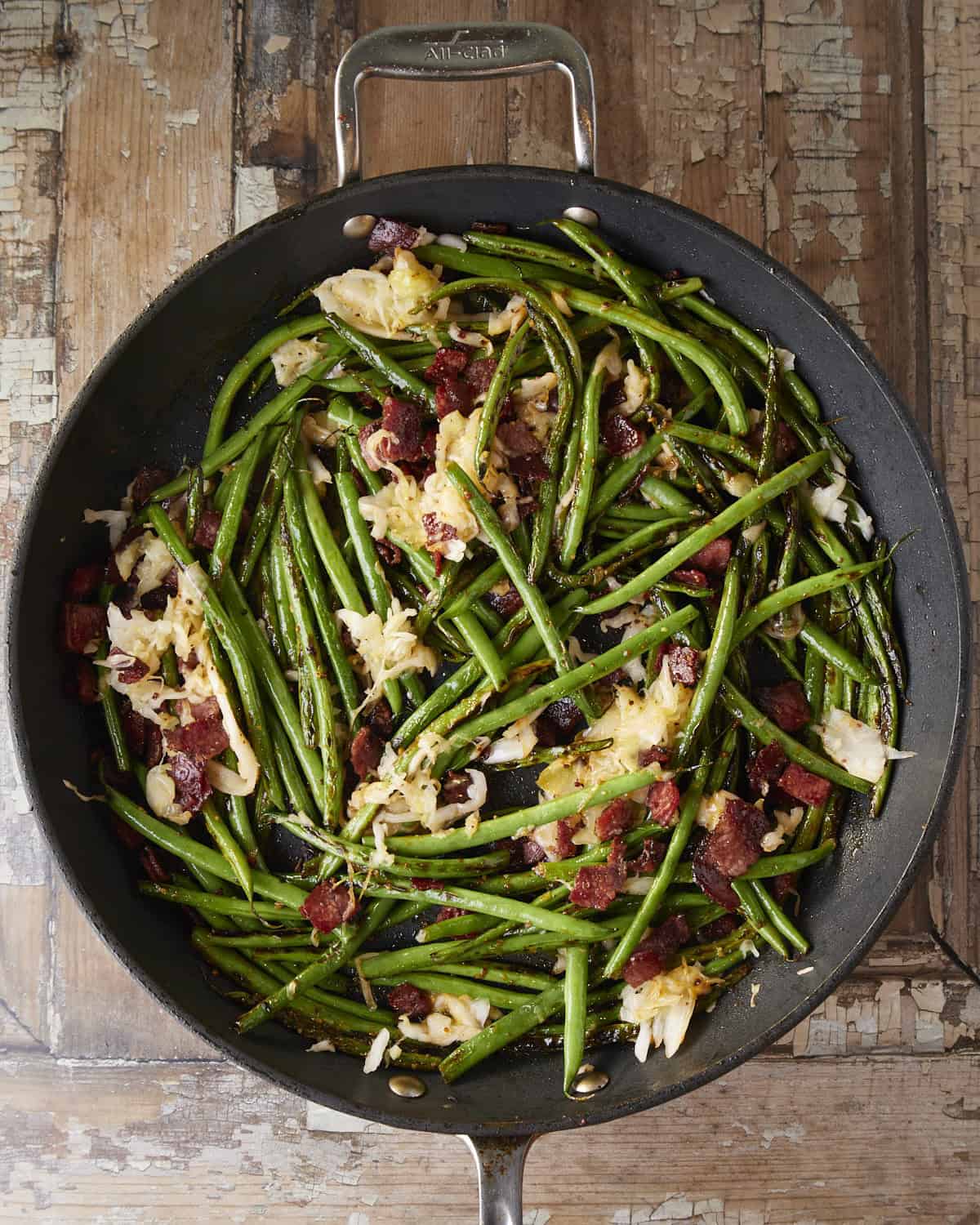 Adding sauce to reduce, pastrami, and kraut.