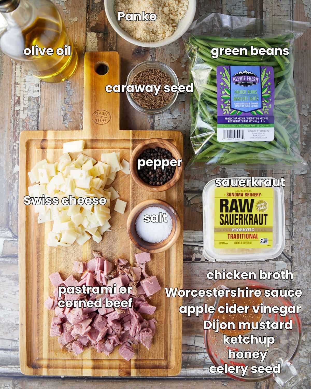 Ingredients needed to make ruben green beans on a wooden backdrop.